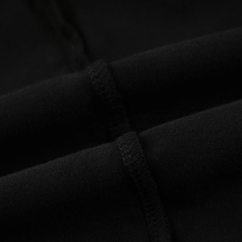 Black enzyme-wash T-shirt fabric seam detail close-up