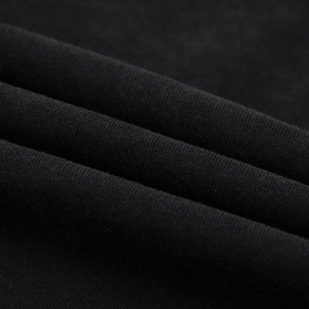 Black enzyme-wash T-shirt fabric texture close-up with fine knit pattern