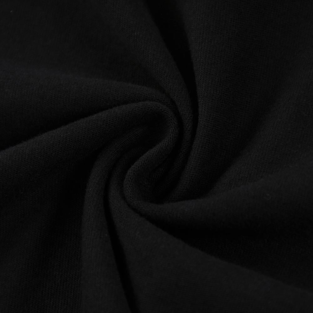 Black enzyme-wash T-shirt fabric close-up, folded knit texture