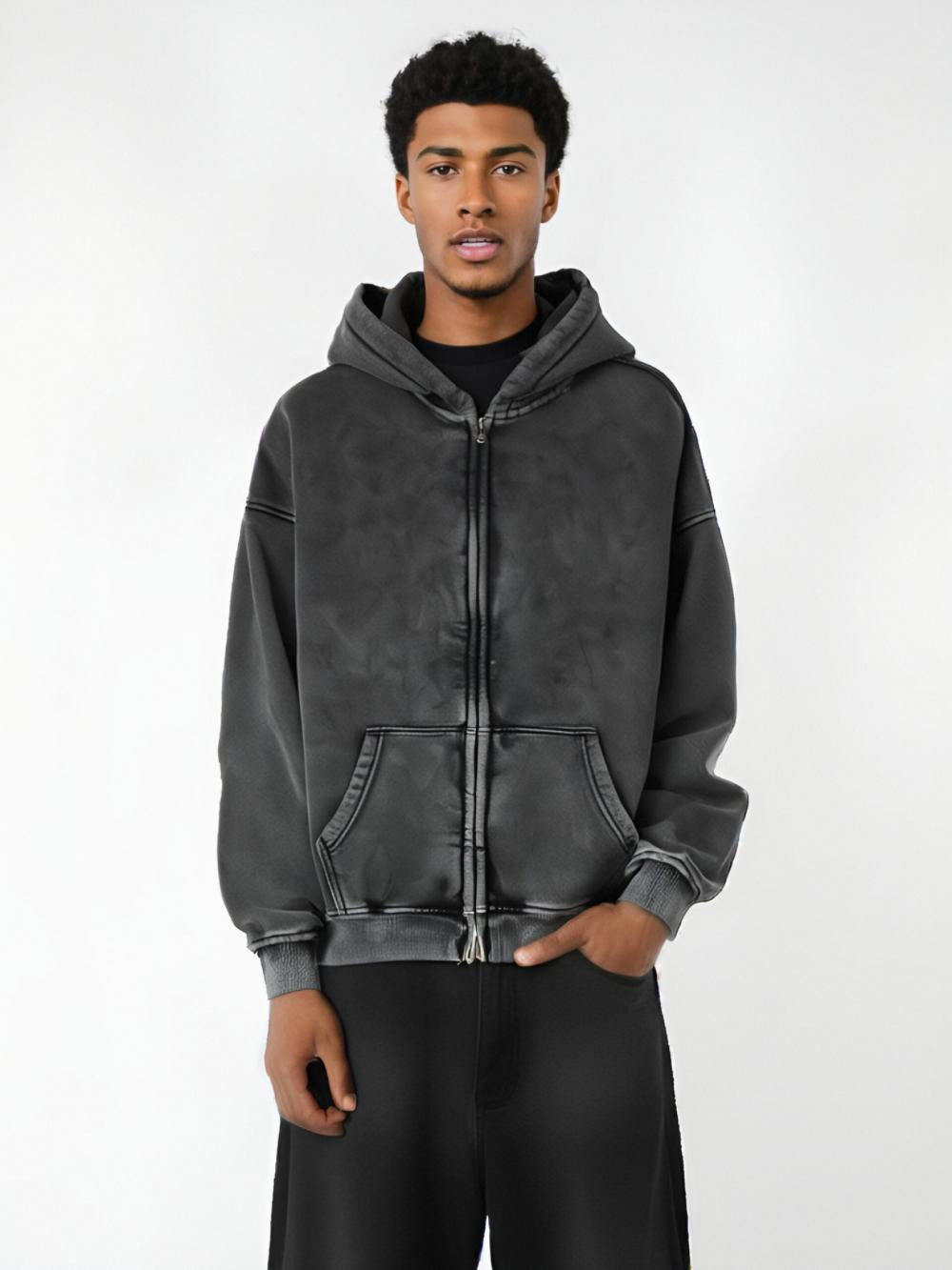 Black acid-wash full-zip hoodie with hood and front pockets, side view