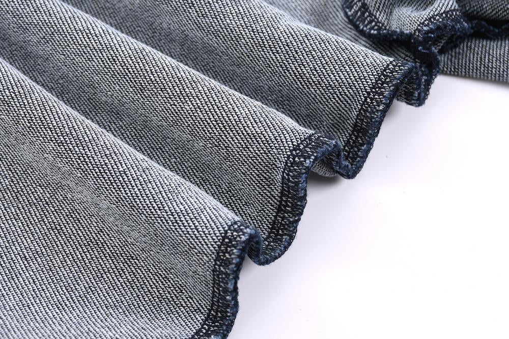 Ribbed sleeve cuff detail with stitched hem on acid wash sweatshirt, light gray-blue