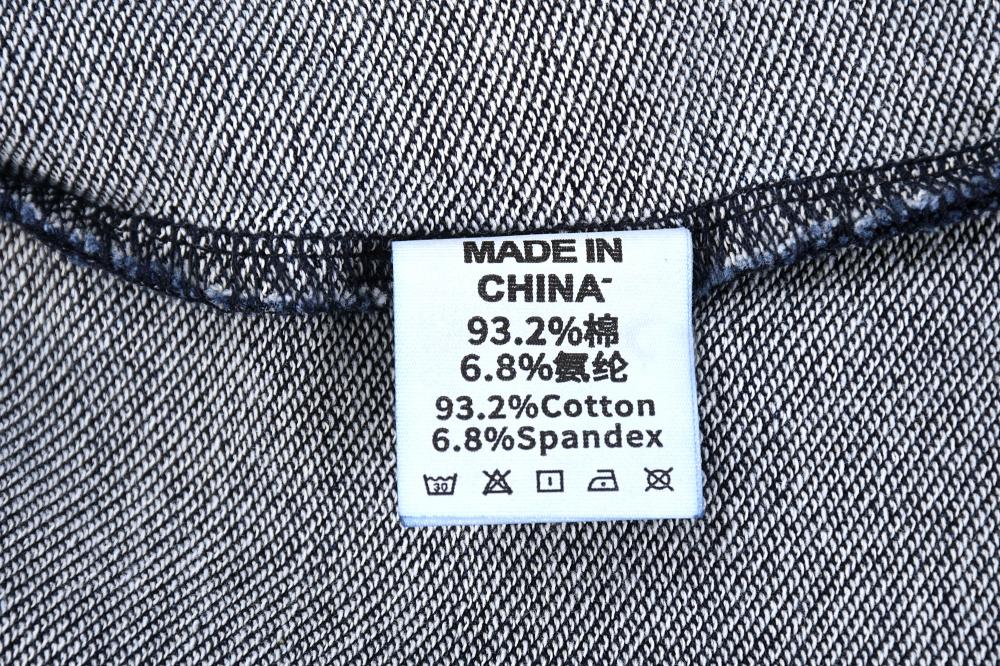 Interior care label on acid wash sweatshirt: cotton, spandex blend, Made in China