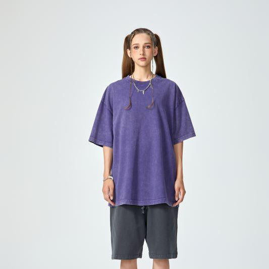 Unisex heavyweight oversized snow-wash T-shirt on model, lavender purple
