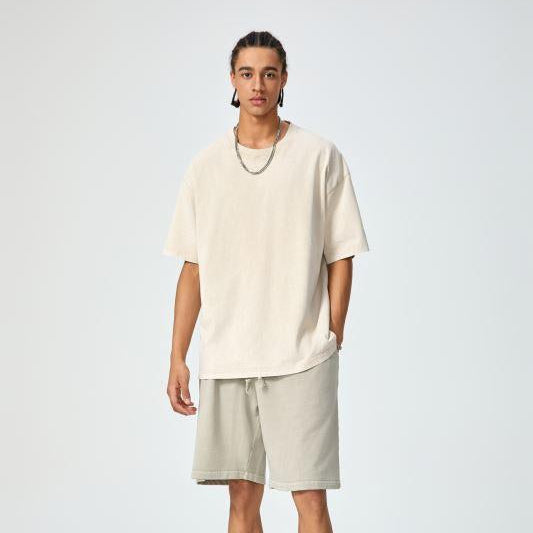 Unisex heavyweight oversized snow-wash T-shirt on model, cream white