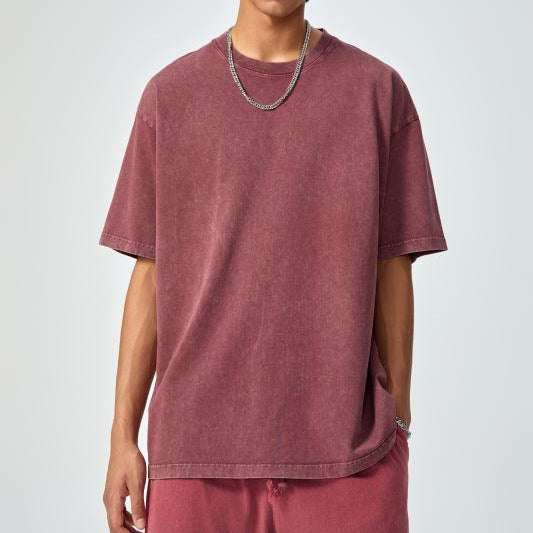 Unisex heavyweight oversized snow-wash T-shirt on model, dusty maroon