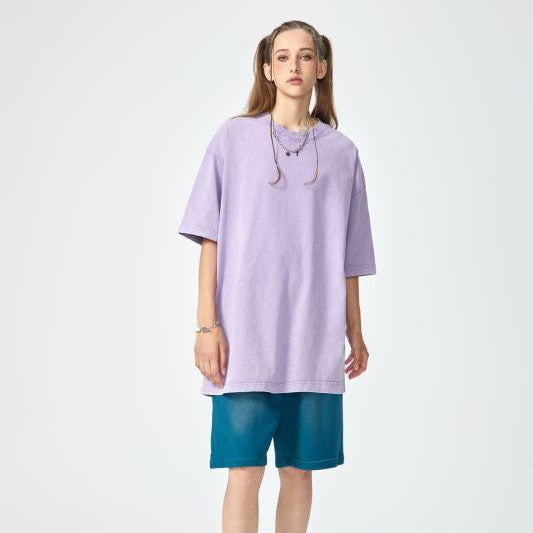 Unisex heavyweight oversized snow-wash T-shirt on model, light lavender
